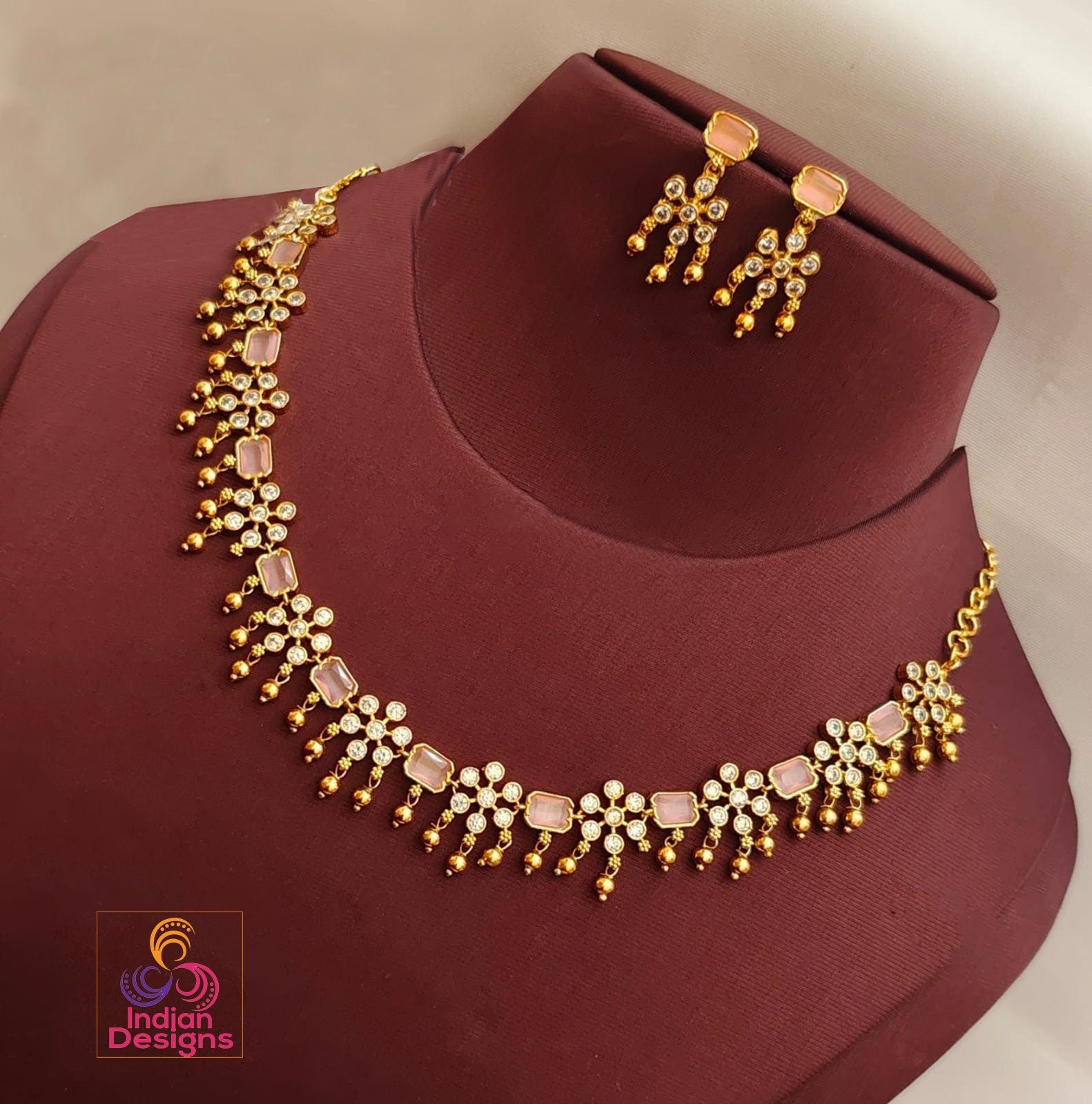 Buy Gold Finish Kundan Navratna Long Pendant Set by ADITYAM JEWELS at Ogaan  Market Online Shopping Site
